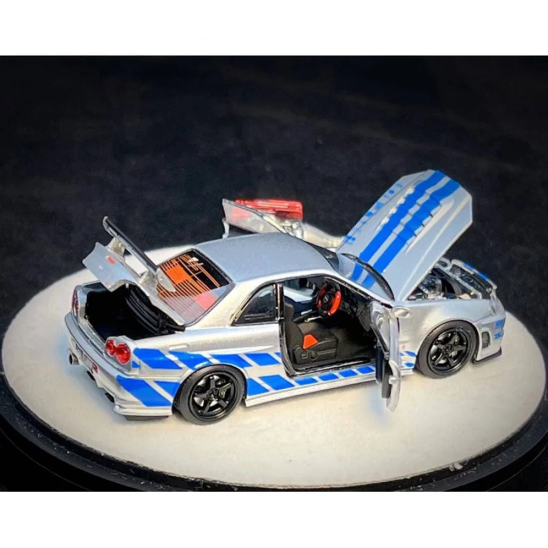 PGM X Onemodel 1:64 Nissan GT-R (R34) Z-Tune Silver W/ Blue Stripe - Fast & Furious