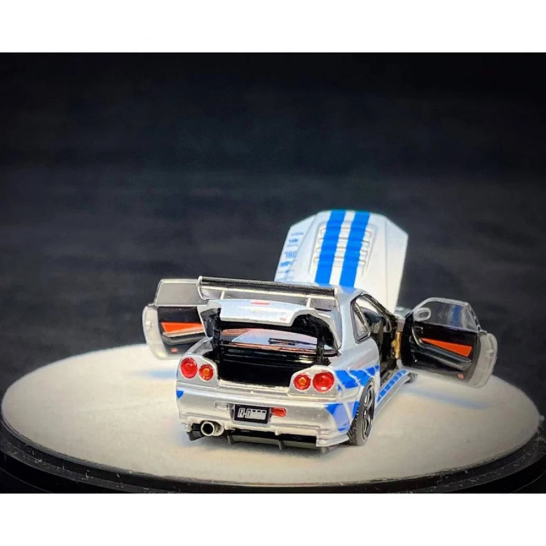 PGM X Onemodel 1:64 Nissan GT-R (R34) Z-Tune Silver W/ Blue Stripe - Fast & Furious