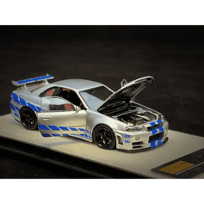 PGM X Onemodel 1:64 Nissan GT-R (R34) Z-Tune Silver W/ Blue Stripe - Fast & Furious