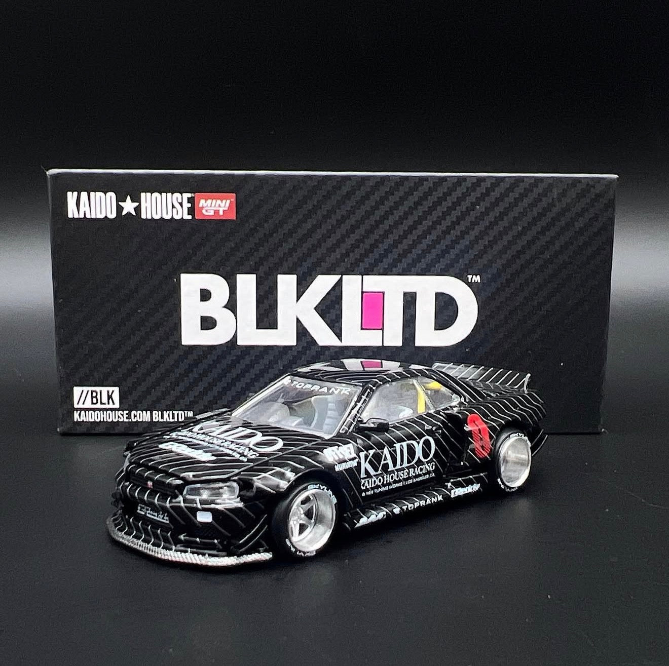 Kaido House 1:64 BLKLTD Nissan Skyline GT-R (R34) Kaido Works Gloss Black With CHASE Pin - KHMG050